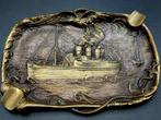 Metalen asbak met stoomschip, Ophalen