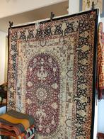 Tapis de Ghom en soie, Ophalen