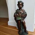 Beeld van kind met bloemenmand, Ophalen