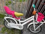 Meisjesfiets met mand en poppenzitje, Ophalen