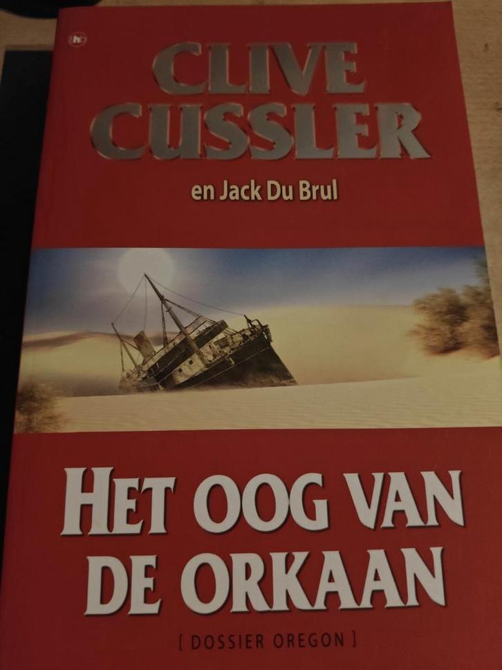Clive Cussler - Het oog van de orkaan, Livres, Thrillers, Comme neuf, Amérique, Enlèvement