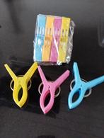 Grote wasknijpers om strandlaken te bevestigen, Ophalen