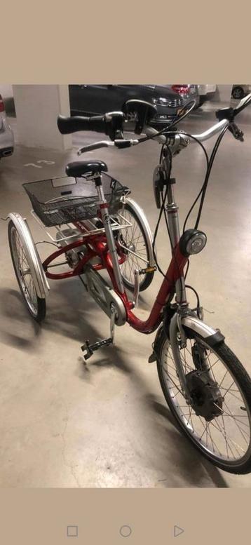 Elektrische driewieler fiets van raam maxi 