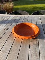 Schaal in terra cotta, Ophalen