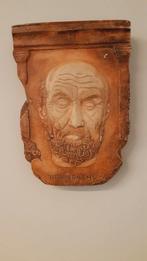 kunstwerk Hippocrates in reliëf, Ophalen