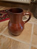 Oude waterkan in aardewerk, Ophalen