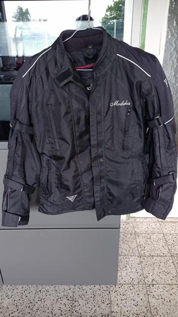 Veste moto Modeka dame T36 en très bon état. disponible aux enchères