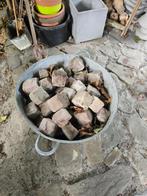 Zinken kuip met kasseien, Ophalen