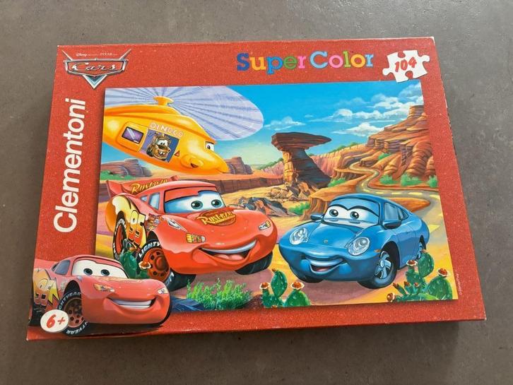 Cars puzzel 104 stukjes, Kinderen en Baby's, Speelgoed | Kinderpuzzels, Gebruikt, 6 jaar of ouder, Meer dan 50 stukjes, Ophalen of Verzenden