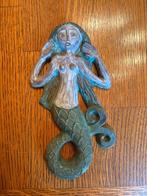 Zeemeermin beeldje, Ophalen