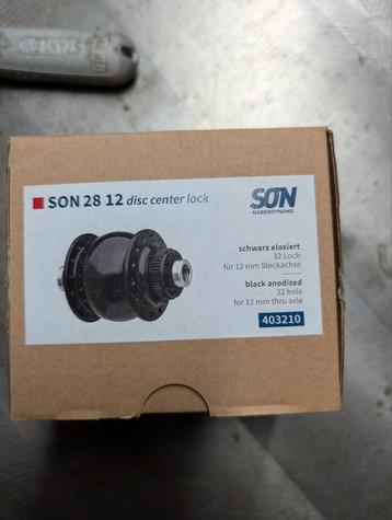 SON 28 NAAFDYNAMO CENTERLOCK STEEKAS. Nieuw in doos., Fietsen en Brommers, Fietsonderdelen, Ophalen of Verzenden, Nieuw
