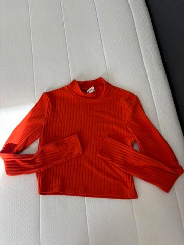 Haut orange/rouge à manches longues  beschikbaar voor biedingen
