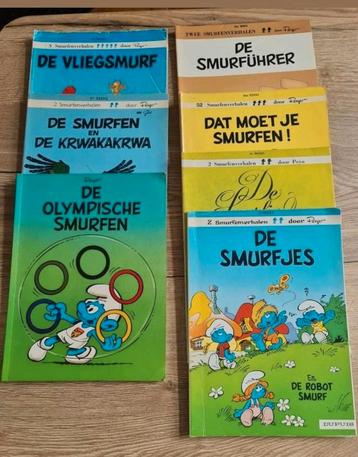 Strips :  de smurfen ( 7 stuks : oudere strips '70 - '80 )  beschikbaar voor biedingen