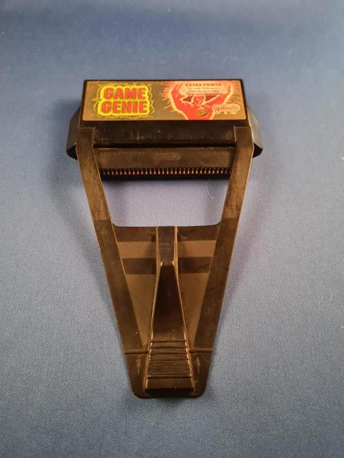 NES - Game Genie, Hobby en Vrije tijd, Verzamelkaartspellen | Pokémon, Gebruikt, Verzenden
