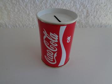 Tirelire marque Coca cola métallique. 