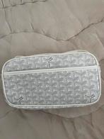 Handtas goyard, Ophalen