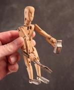 Houten miniatuur mannequin, Ophalen