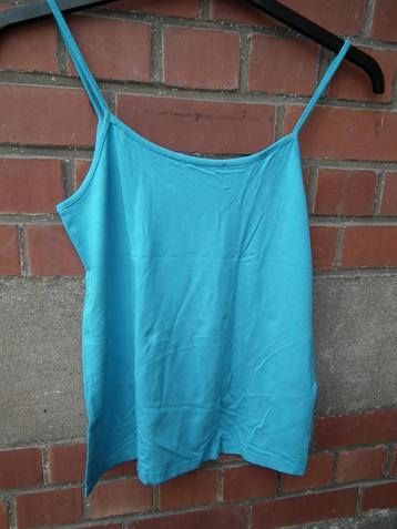 Top voor dames. Maat 4. Turkooisblauwe kleur. beschikbaar voor biedingen