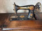 Oude singer naaimachine, Ophalen