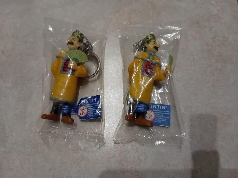 Lot de 2 porte-clés scellés Jansen & Janssen Tintin, Enlèvement ou Envoi, Tintin, Neuf, Statue ou Figurine