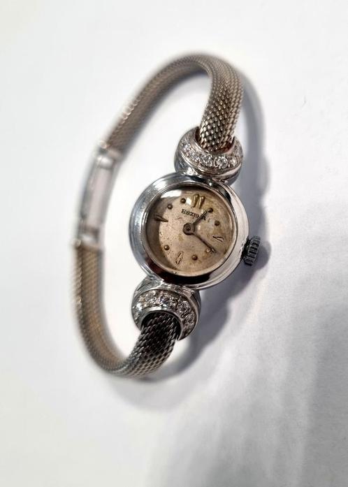 Puur 14 karaat witgoud Eszeha horloge, bezet met diamant., Handtassen en Accessoires, Horloges | Antiek, Ophalen of Verzenden
