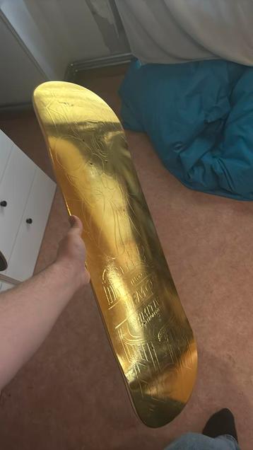 Skateboard primitive gold