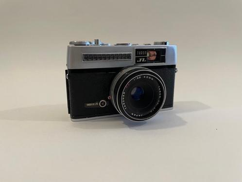 Taron camera met vaste lens en lederen tasje, TV, Hi-fi & Vidéo, Appareils photo analogiques, Utilisé, Compact, Autres Marques