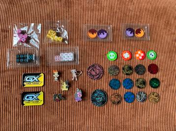 Pokémon munten, pins, dobbelstenen beschikbaar voor biedingen