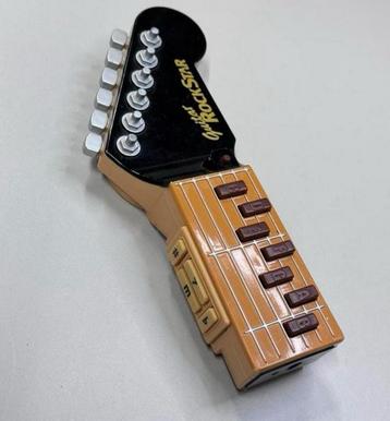 Tomy Guitar RockStar - Infra Red Beam Air Gitaar 8 liedjes beschikbaar voor biedingen