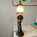 Bronzen beeld met licht., Ophalen
