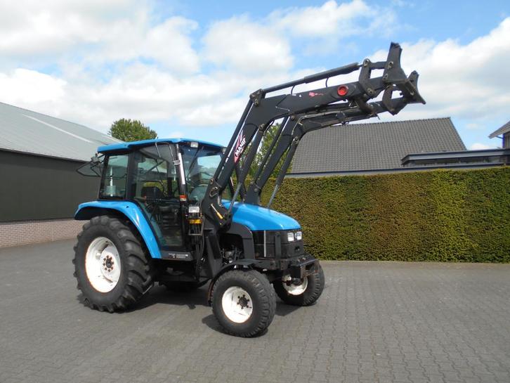New Holland TL 70 + frontlader, Zakelijke goederen, Landbouw | Tractoren, 250 tot 500 cm, New Holland, tot 80 Pk, Gebruikt, Ophalen of Verzenden