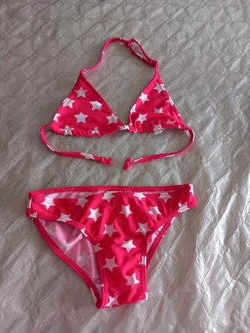 Donkerroze bikini met sterren 134/140, heel goede staat beschikbaar voor biedingen