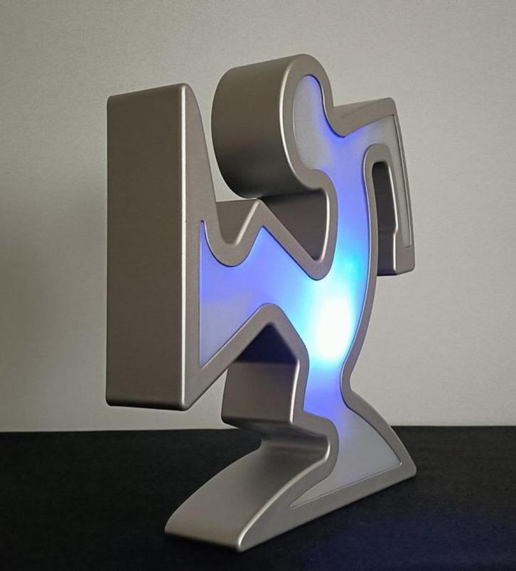 Keith Haring / La Linea Lamp Osvaldo Cavandoli zilver Nieuw!, Antiek en Kunst, Kunst | Designobjecten, Ophalen of Verzenden