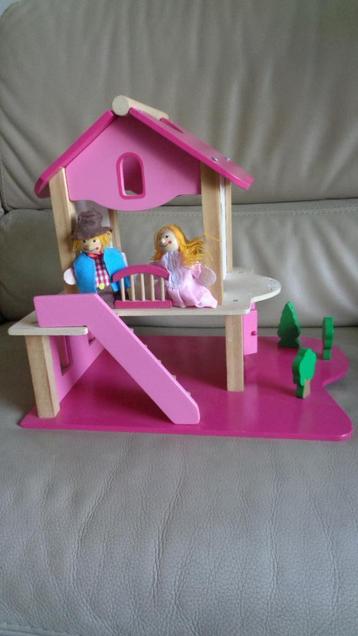 Roze poppenhuis met popjes 
