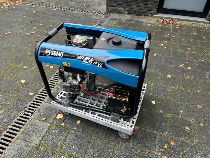 SDMO Diesel 6500 TE XL, Doe-het-zelf en Bouw, Aggregaten, Zo goed als nieuw, Dieselolie, 5 tot 10 kVA, Elektrisch startend, Ophalen
