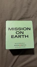 Oméga X Swatch Mission on Earth, Handtassen en Accessoires, Horloges | Heren, Overige materialen, Gebruikt, Polshorloge, Swatch