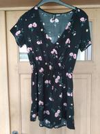 Knappe zwarte jumpsuit met bloemetjes Divided maat 34, Divided, Zwart, Ophalen of Verzenden, Zo goed als nieuw
