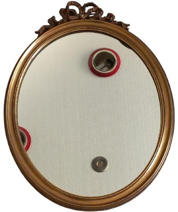 ovale spiegel met strikmotief. beschikbaar voor biedingen