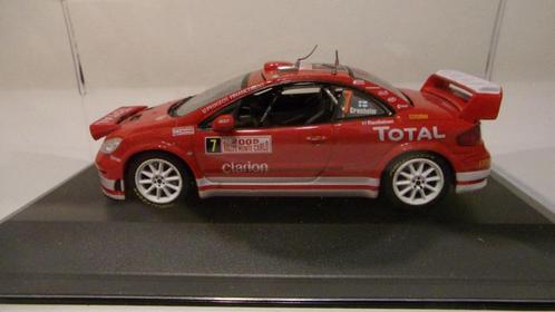 PEUGEOT 307 WRC GRONHOLM M-C 05.IXO 1/43 IMPEC + VITRINE, Hobby en Vrije tijd, Modelauto's | 1:43, Zo goed als nieuw, Auto, Overige merken