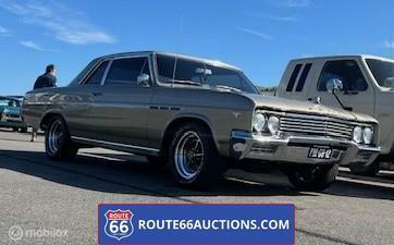 Buick Skylark Coupe 1965 | Route 66 auctions, Auto's, Oldtimers, Bedrijf, Te koop, Buick, Benzine, Coupé, 2 deurs, Automaat, Bruin