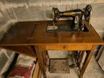 Oude mechanische naaimachine, Ophalen