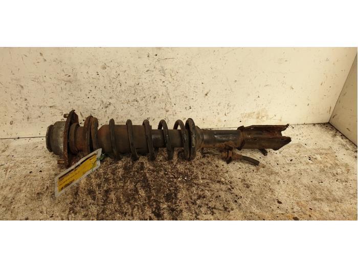 Schokdemperpoot links-voor van een Subaru Vivio, Auto-onderdelen, Ophanging en Onderstel, Subaru, Gebruikt, 3 maanden garantie