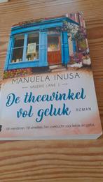 De theewinkel vol geluk - Manuela Inusa, Ophalen of Verzenden, Zo goed als nieuw