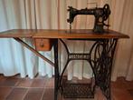 Antieke Singer naaimachine, Ophalen