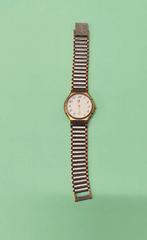 Montre Yves Saint Laurent vintage plaquée or, Montre-bracelet, Autres marques, Enlèvement ou Envoi, 1960 ou plus tard