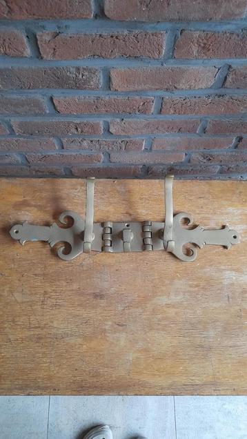 Plooibare wandkapstok in koper beschikbaar voor biedingen