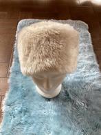 Beige wintermuts, Ophalen