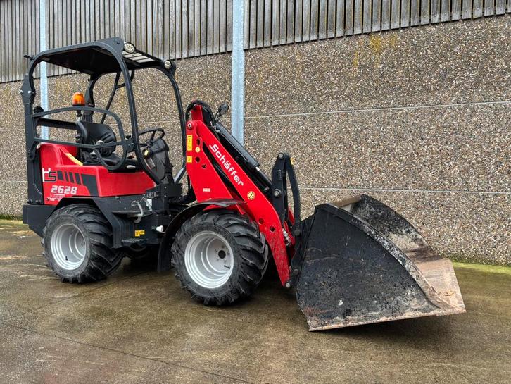 Kniklader schaffer 2628 in nieuwstaat met bak en lepels, Zakelijke goederen, Machines en Bouw | Kranen en Graafmachines, Wiellader of Shovel