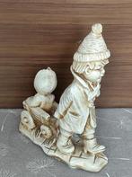 beeld van een jongen en kind in kar, Ophalen of Verzenden