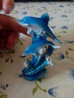 Dolfijnen beeldje, Ophalen